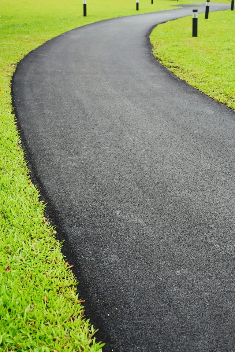 asphalt driveway on grass lawn